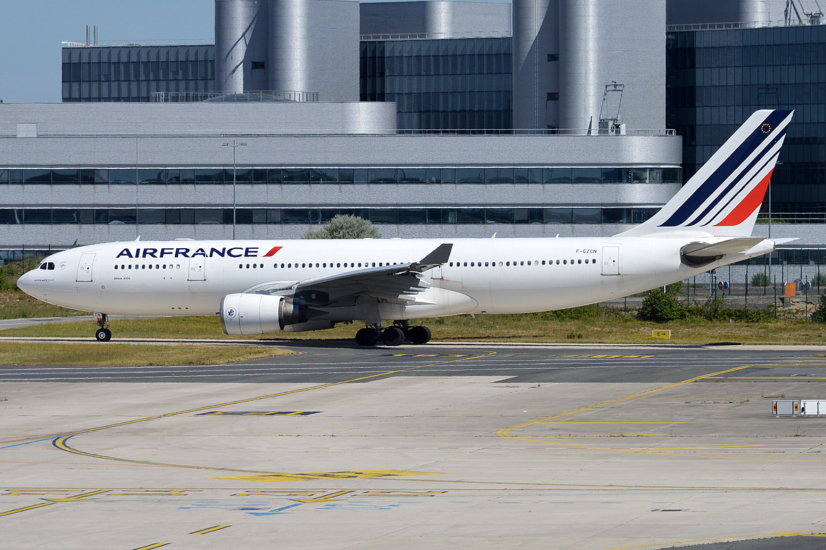 a large white airplane on a runway