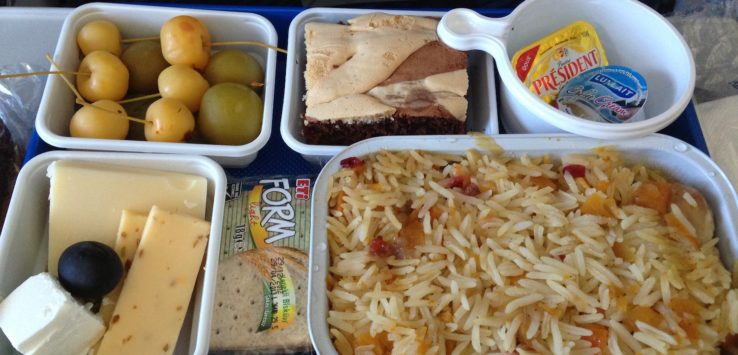 a tray of food on a plane