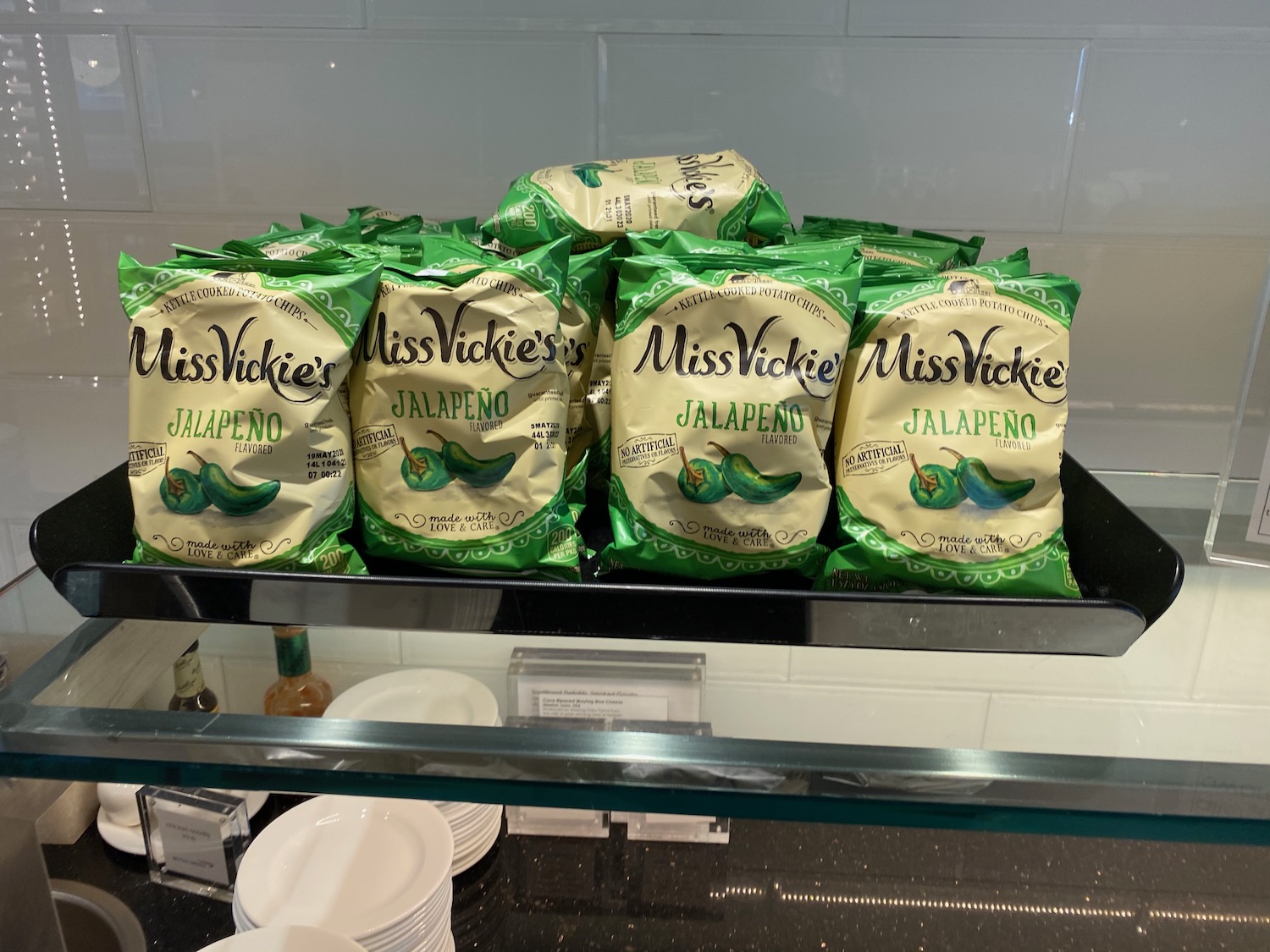 a group of bags of jalapeno on a shelf