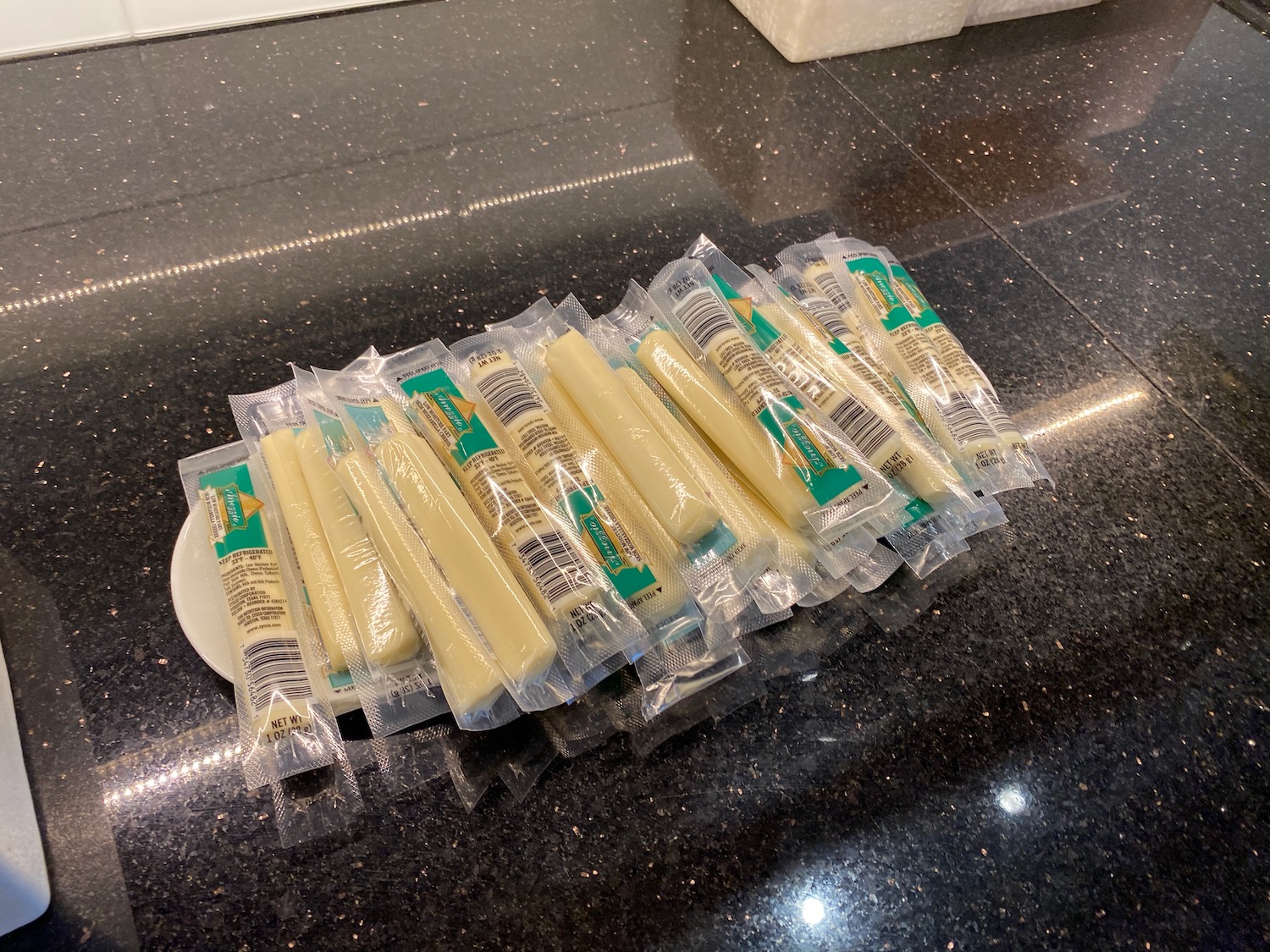 a group of packages of cheese on a counter