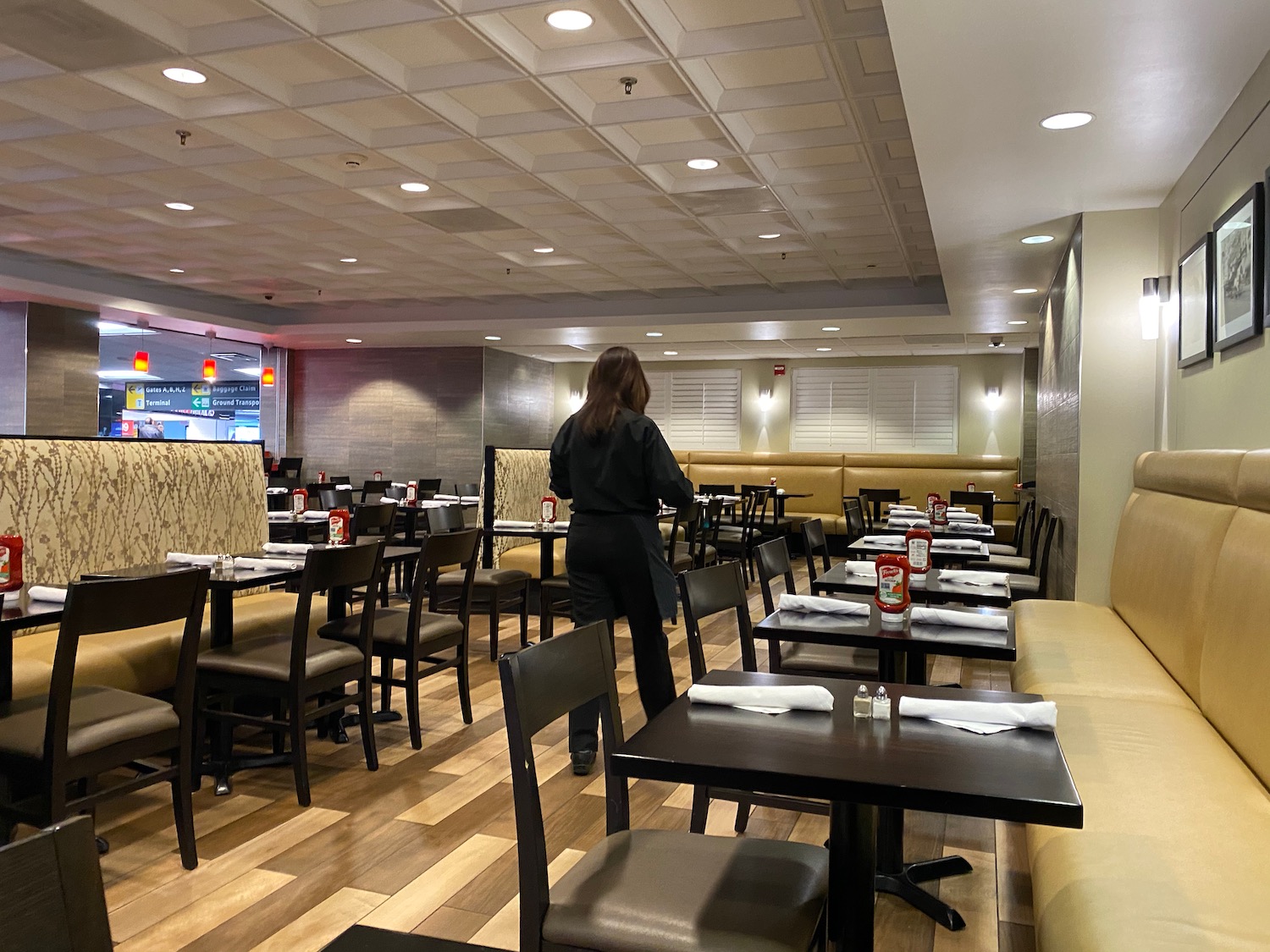 a woman standing in a restaurant