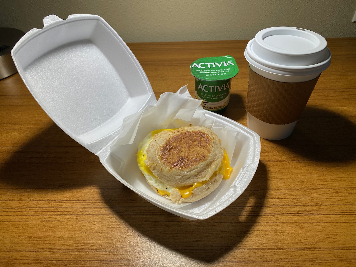 a breakfast sandwich in a styrofoam container