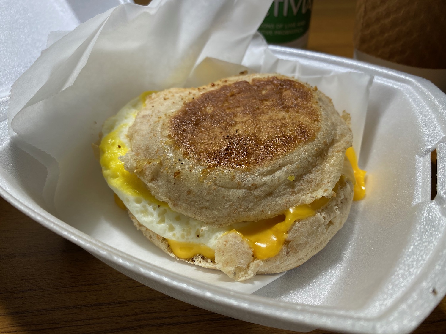 a breakfast sandwich in a styrofoam container