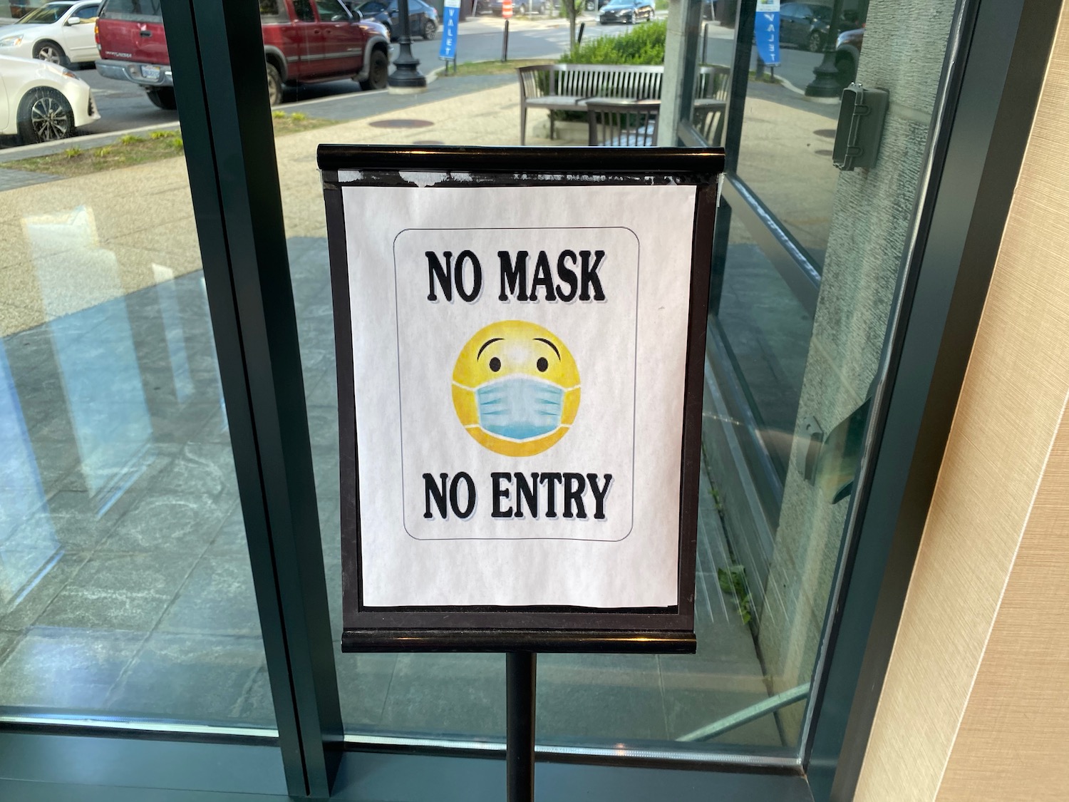 a sign on a stand outside a building