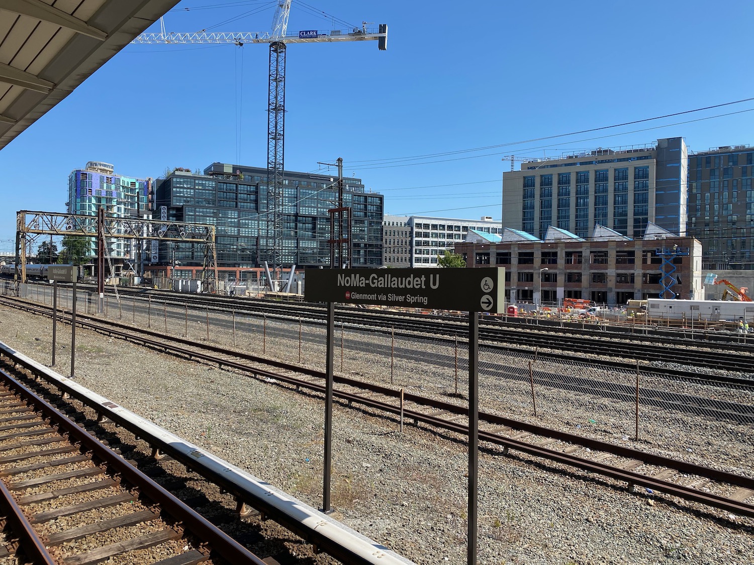 a train tracks with a building in the background