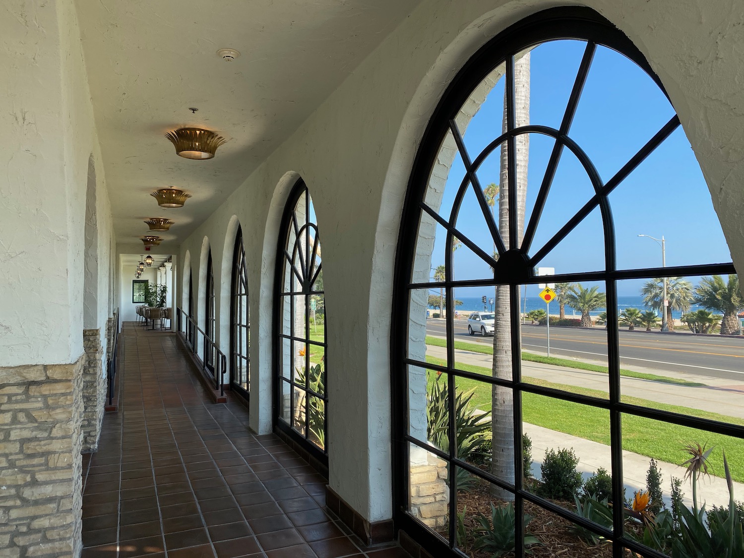 a hallway with arched windows