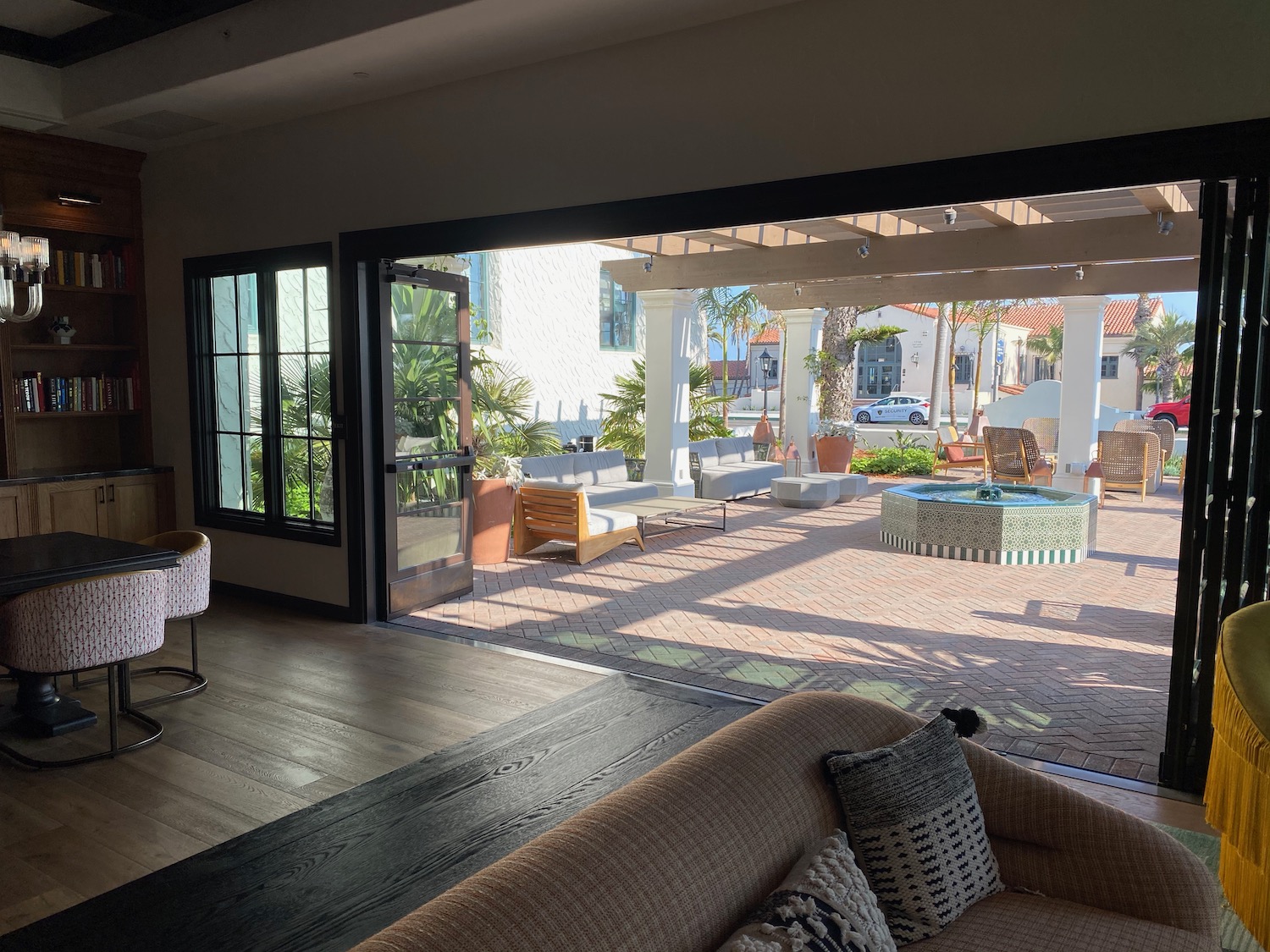 a living room with a patio and a large window