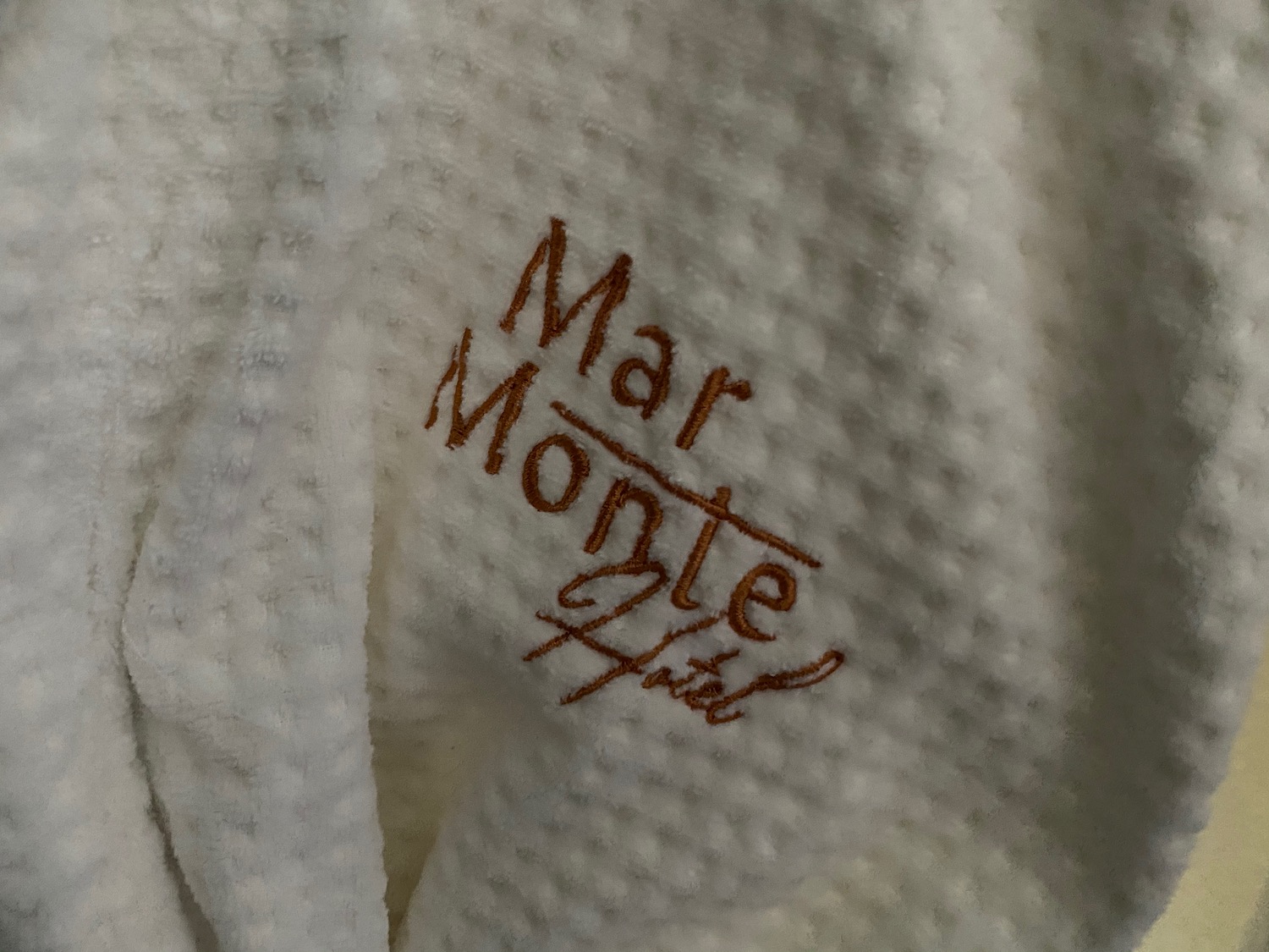 a white towel with brown text