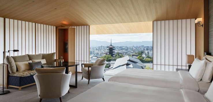 a room with a view of a city and a tall tower