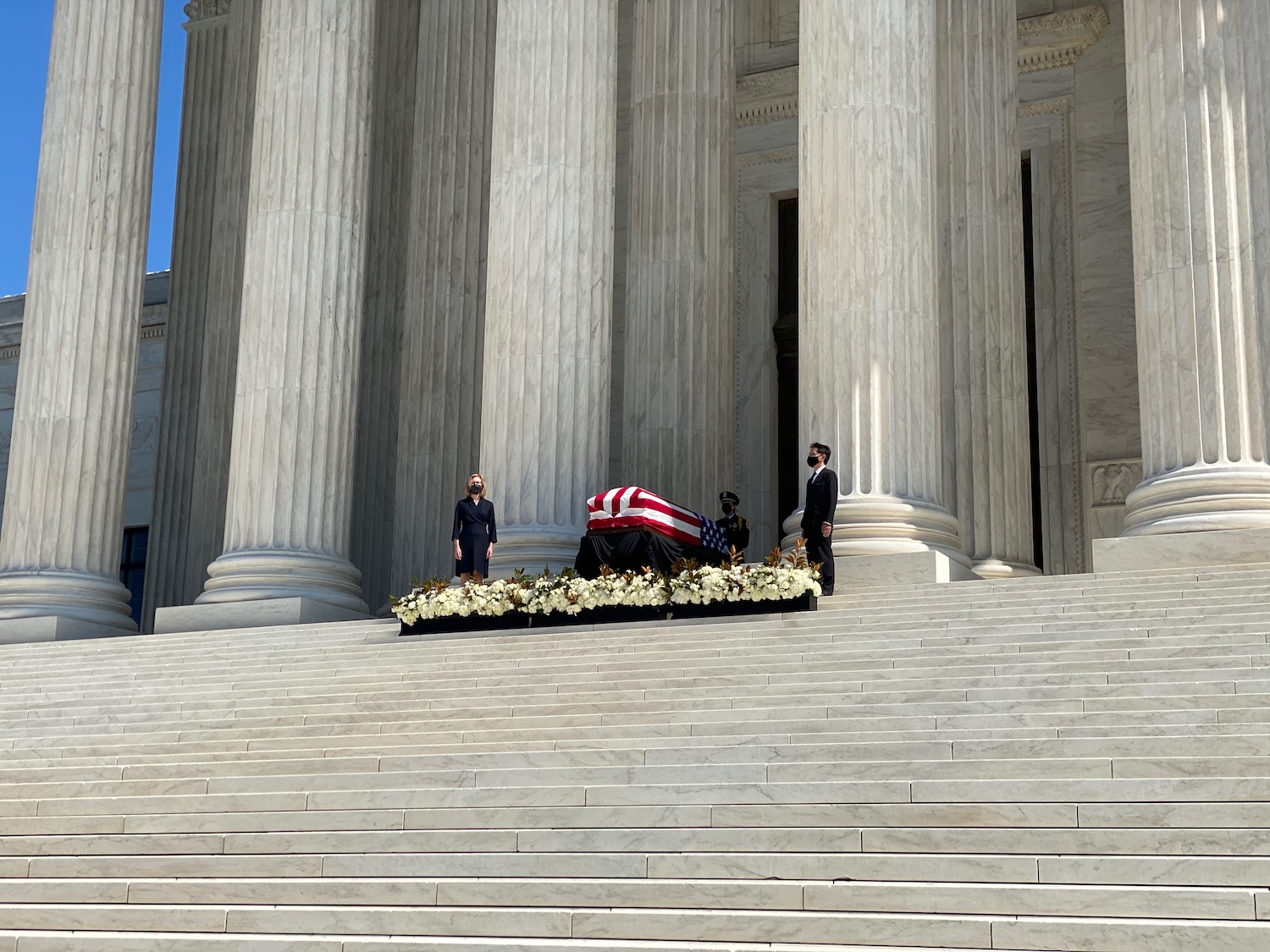 a coffin on the steps of a building