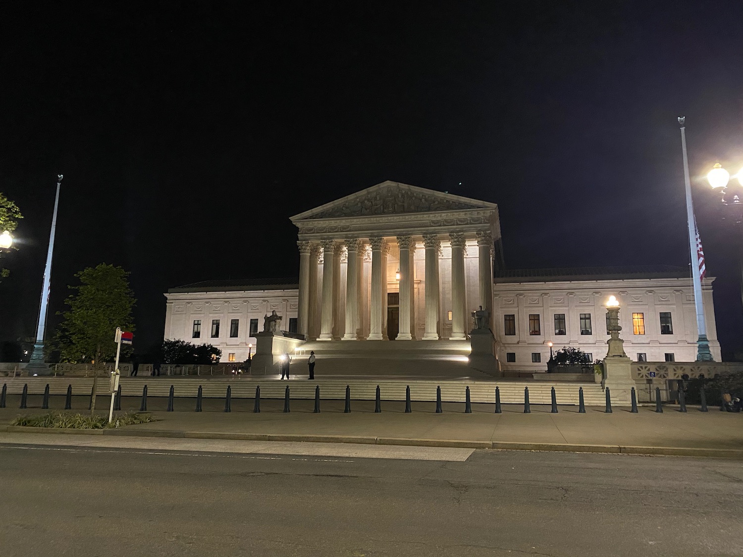 a white building with columns at night