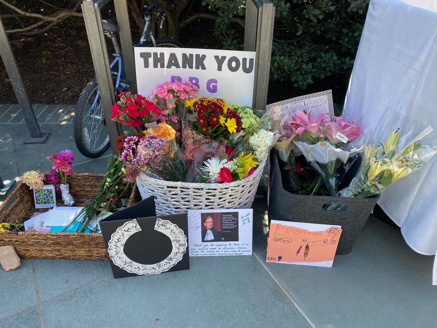 a basket of flowers and cards