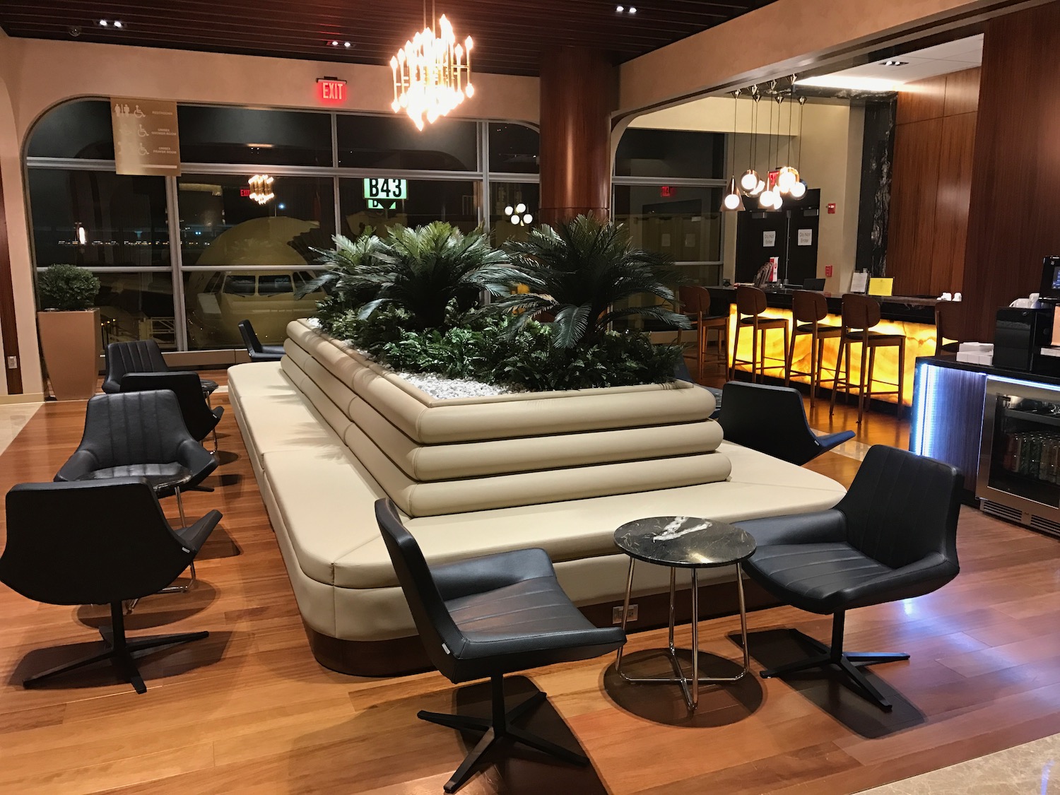 a room with a large white couch and chairs