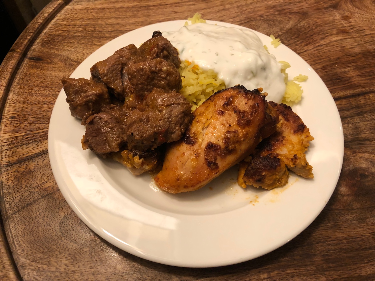 a plate of food on a wood table