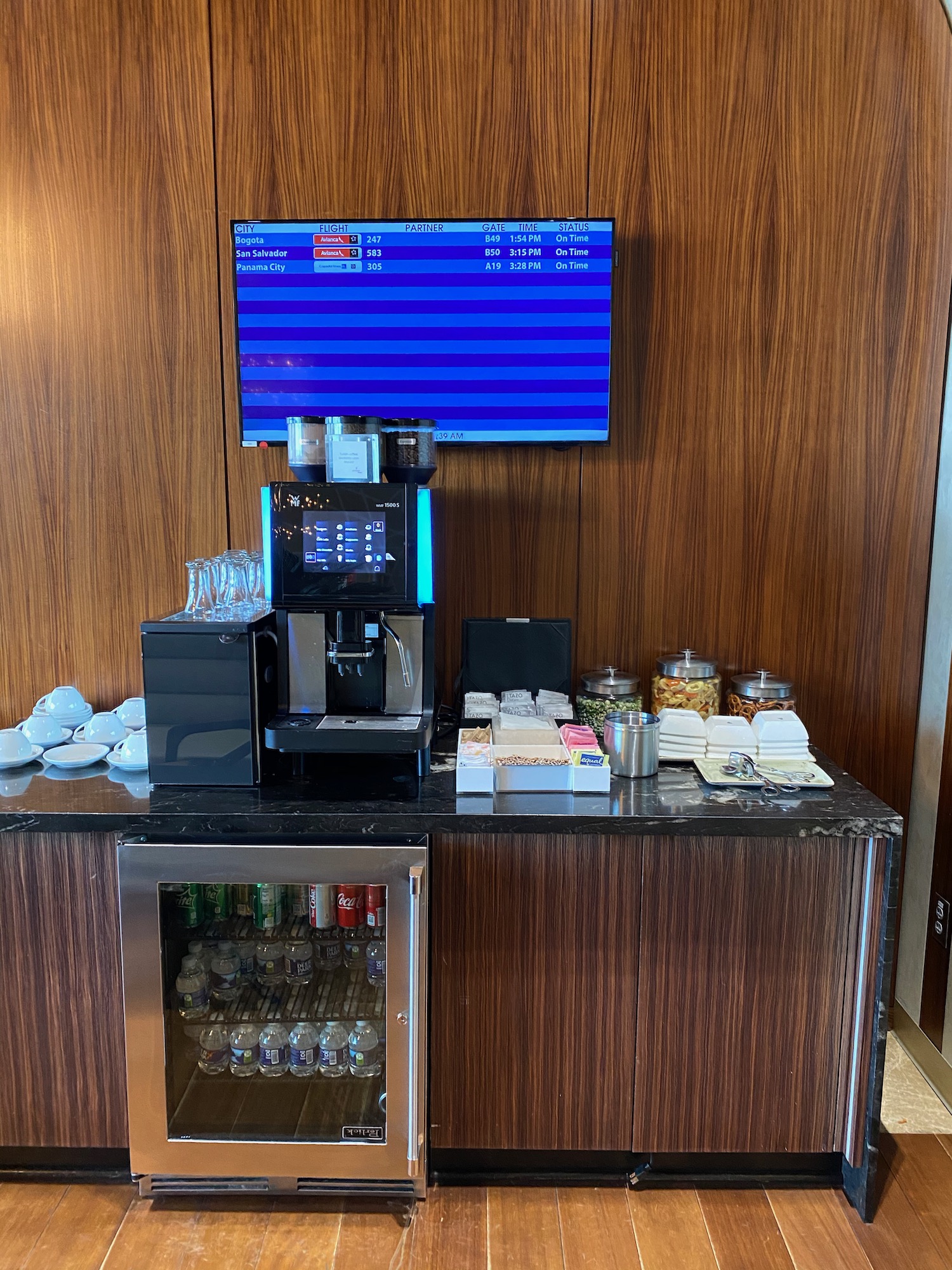 a coffee machine and beverage containers on a counter