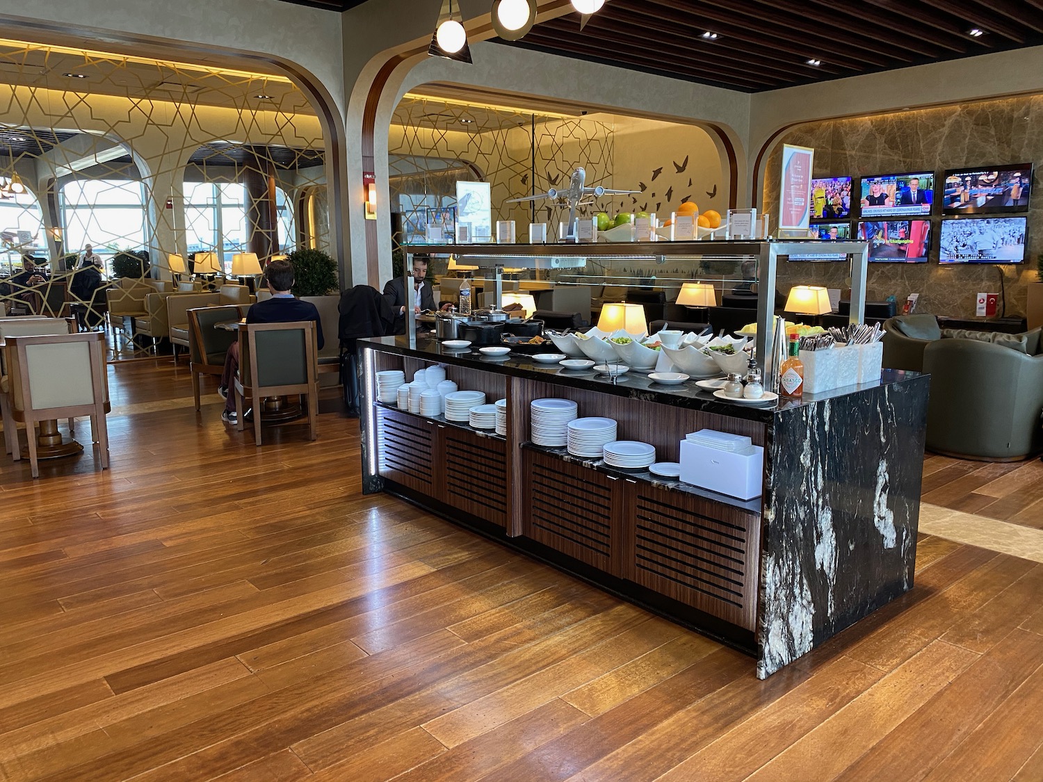 a restaurant with a counter and chairs