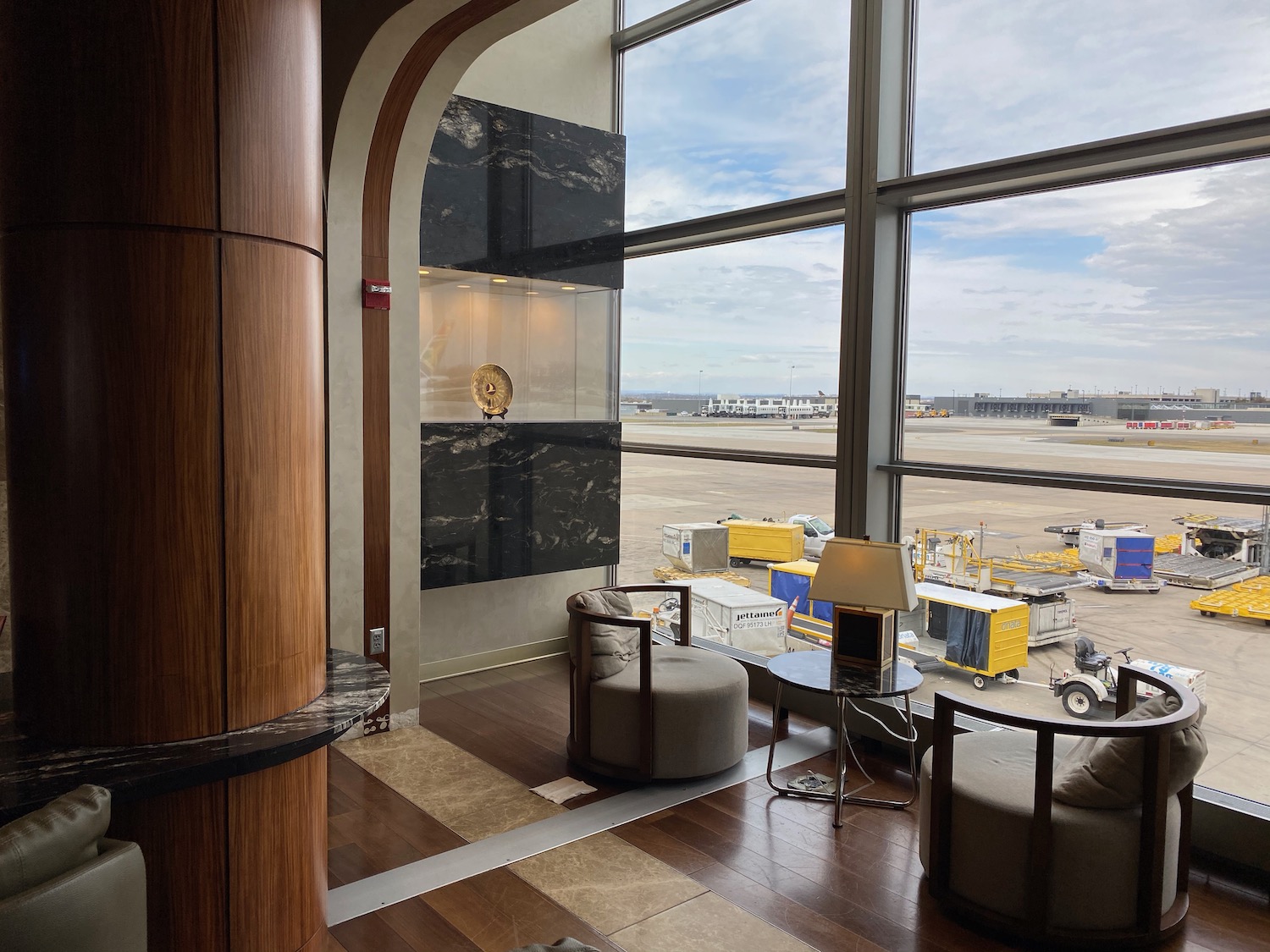 a room with large windows and chairs