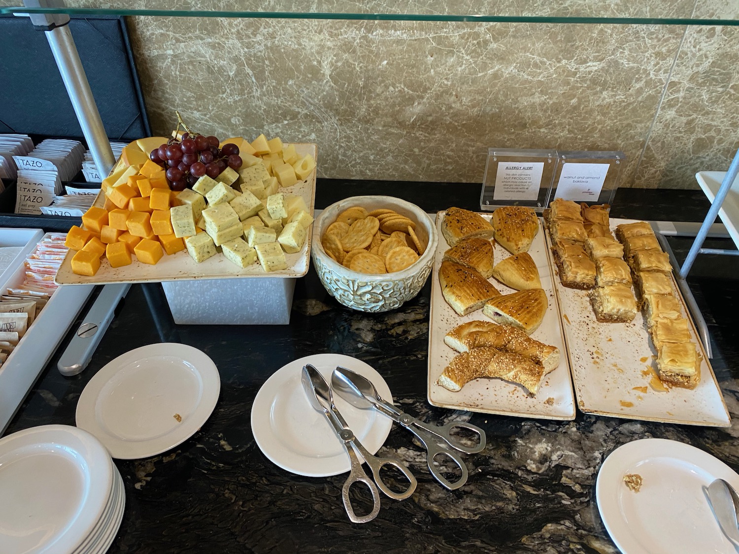 a table with plates of food and utensils