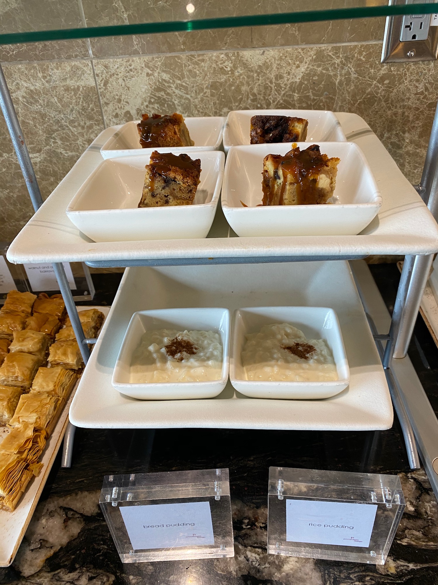 a tray of desserts on a shelf