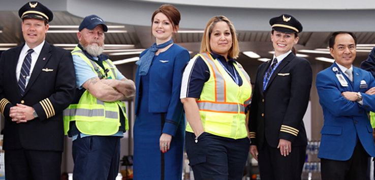 a group of people posing for a photo