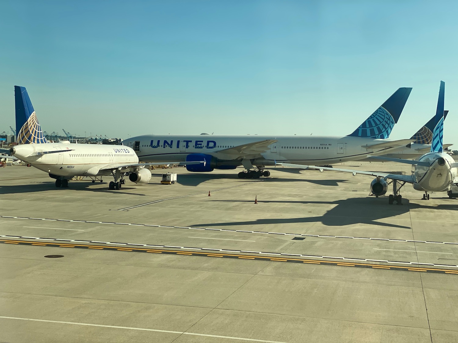 a group of airplanes on a runway