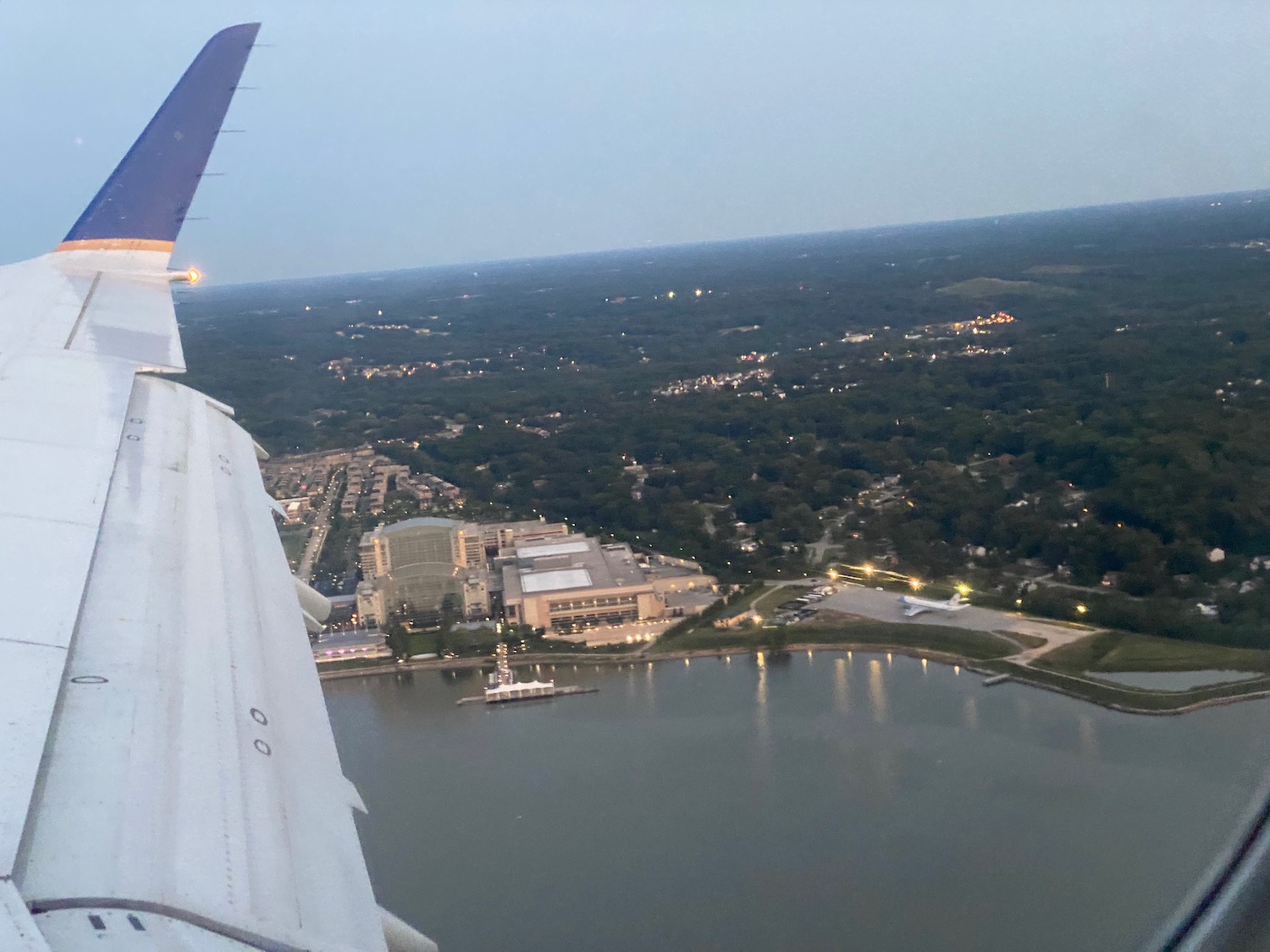 an airplane wing and a body of water