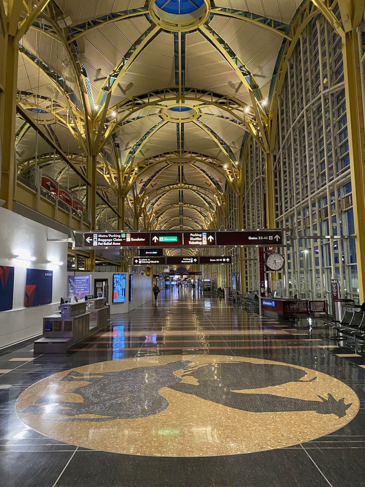 a large building with a tiled floor and a large clock