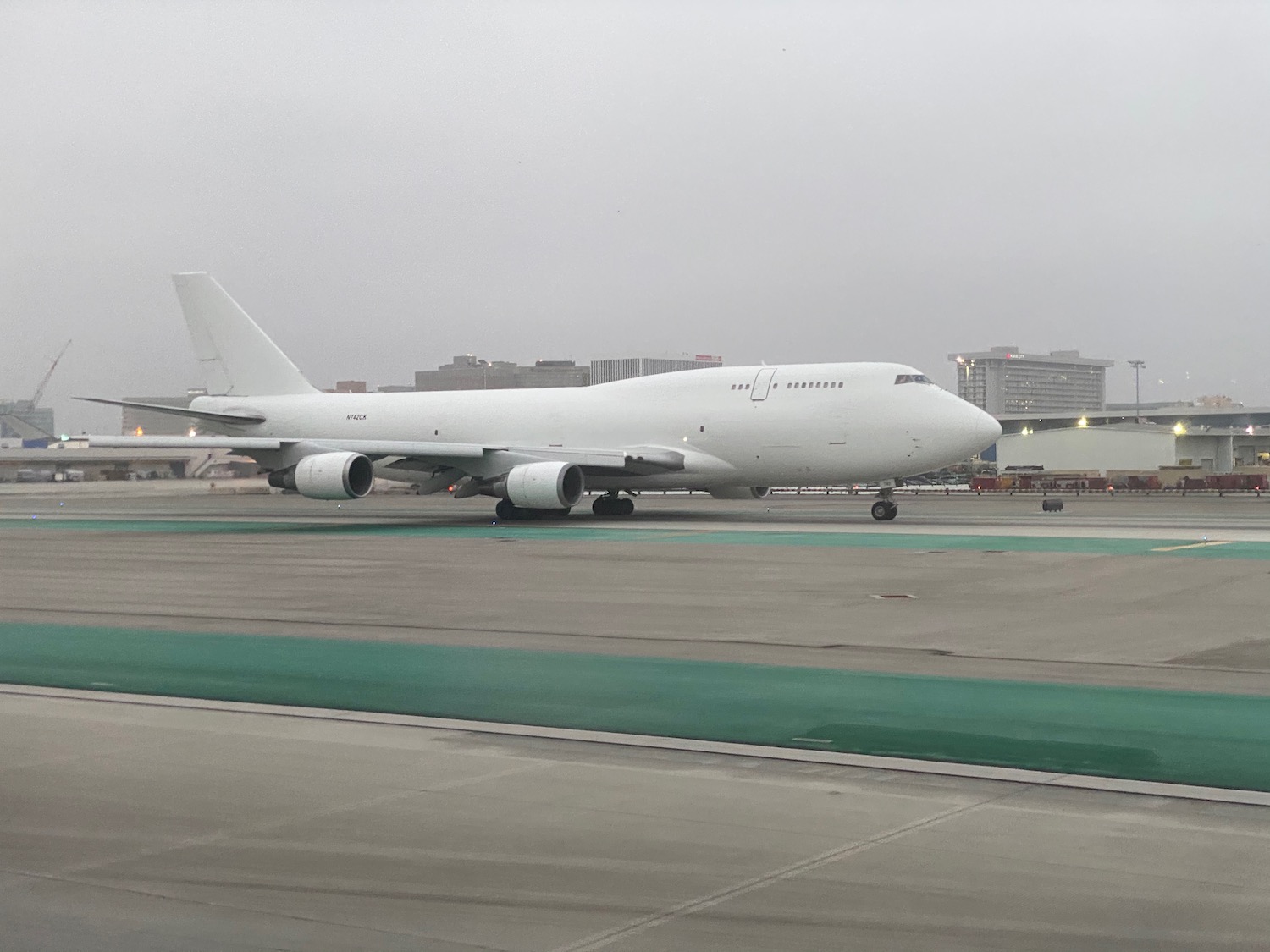 a white airplane on a runway