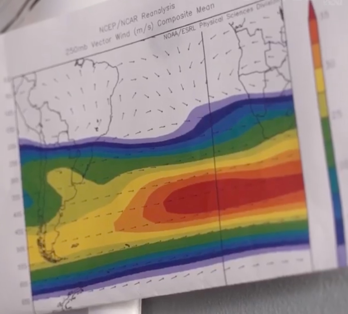 a rainbow colored map on a white surface