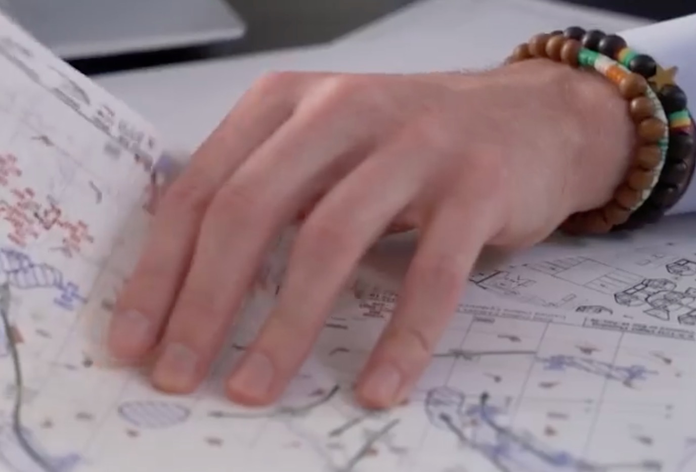 a hand on a map