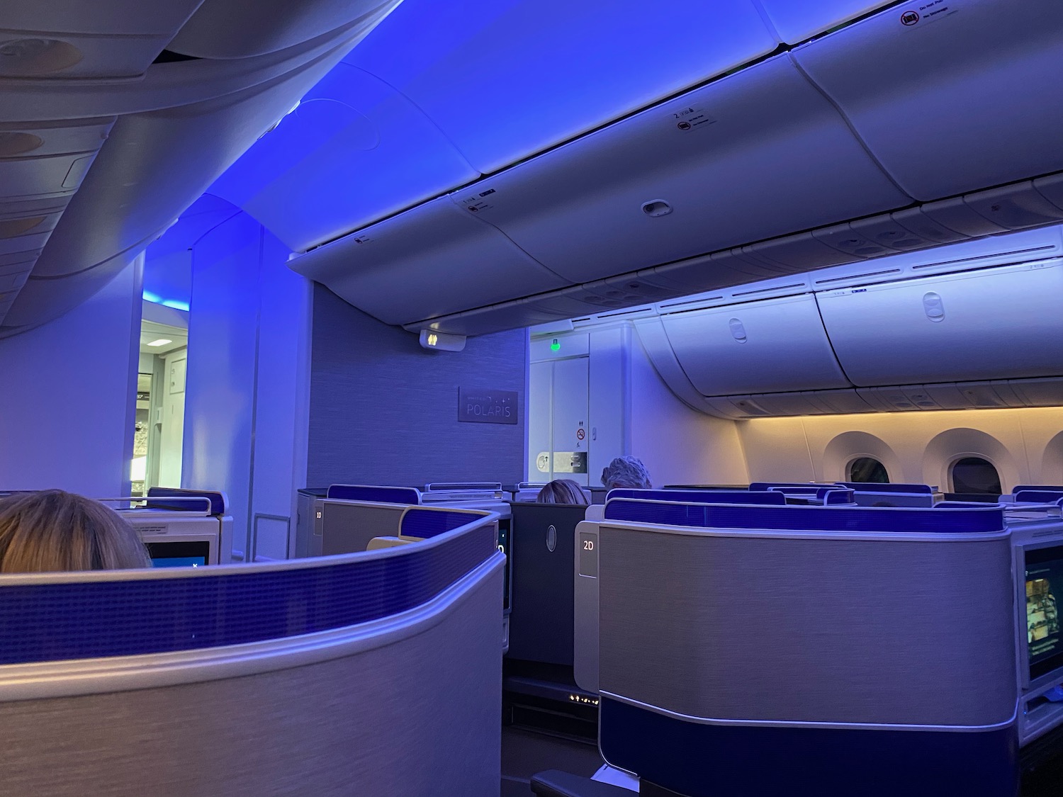 a blue and white interior of an airplane