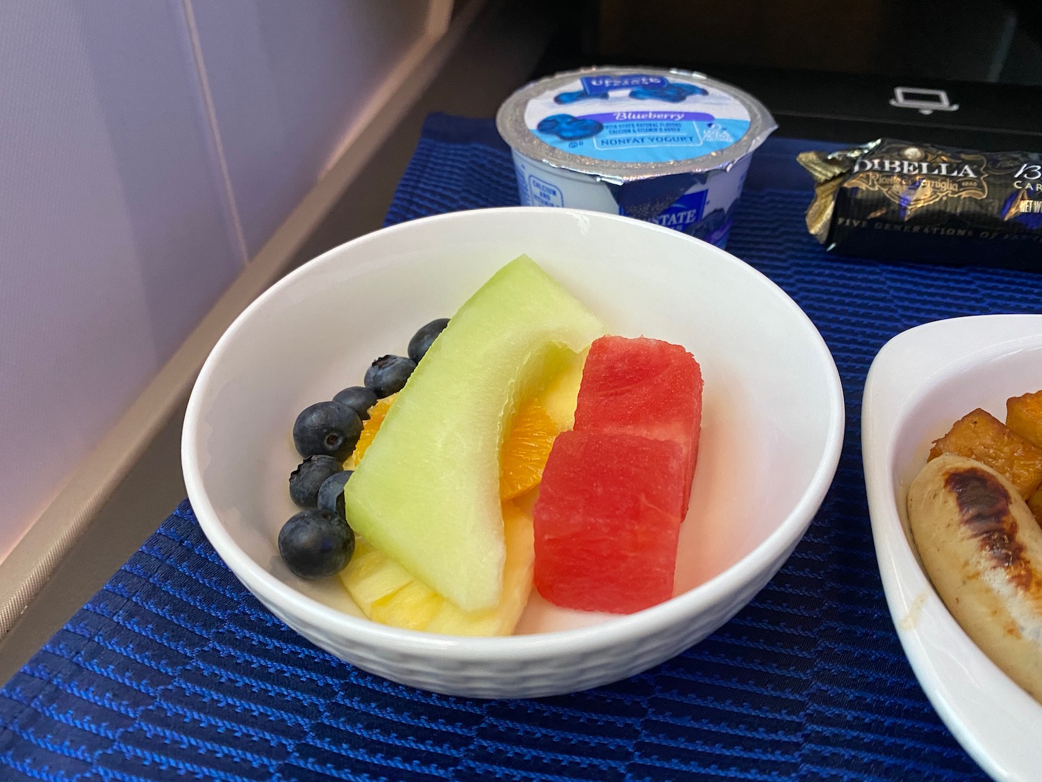 a bowl of fruit and yogurt