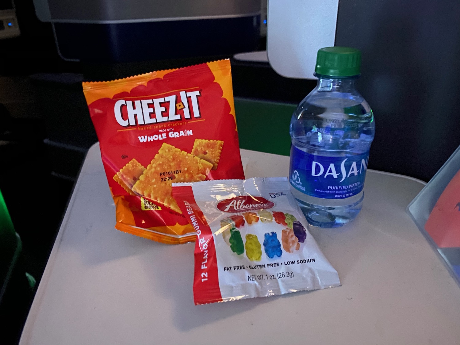 a bottle of water and snacks on a table