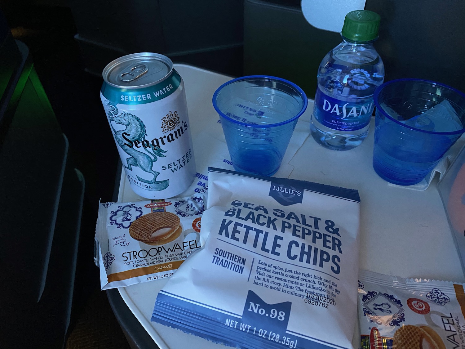 a table with a drink and snacks