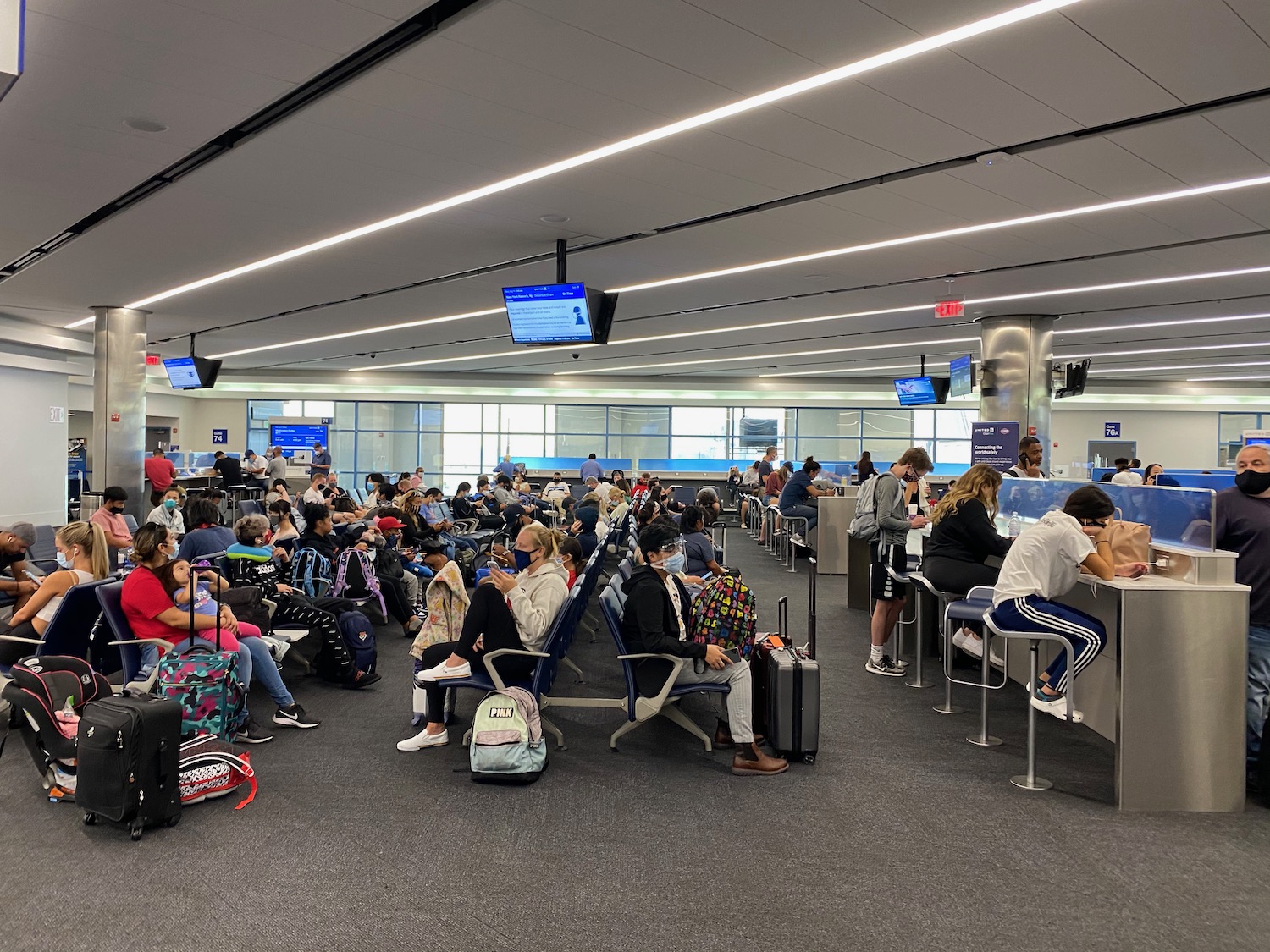 a group of people sitting in a terminal