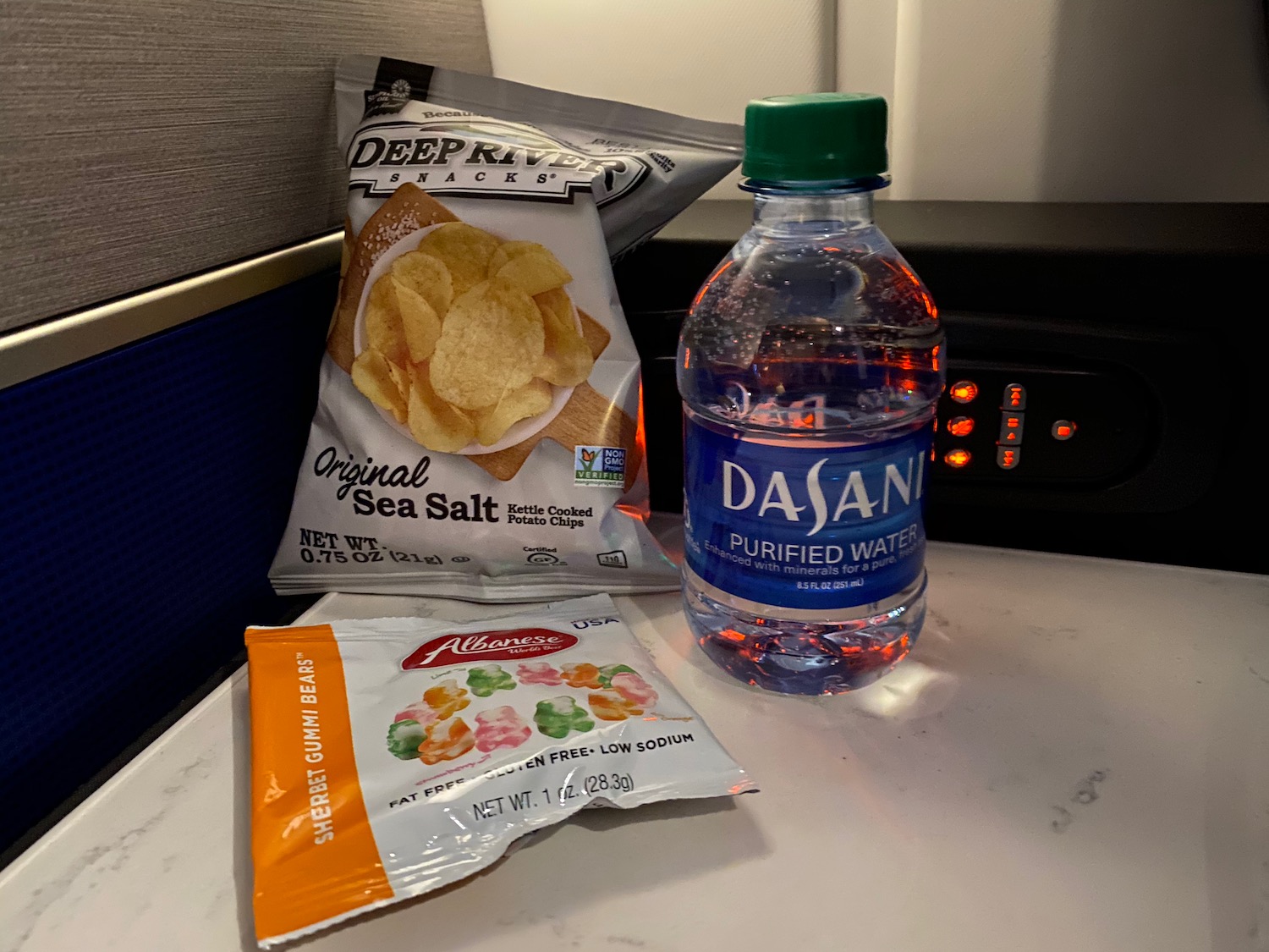 a bottle of water and bags of chips