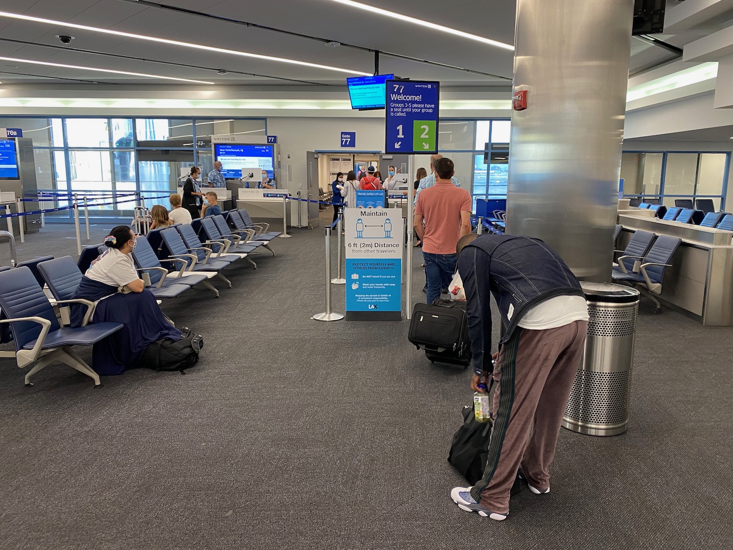 people in an airport waiting area