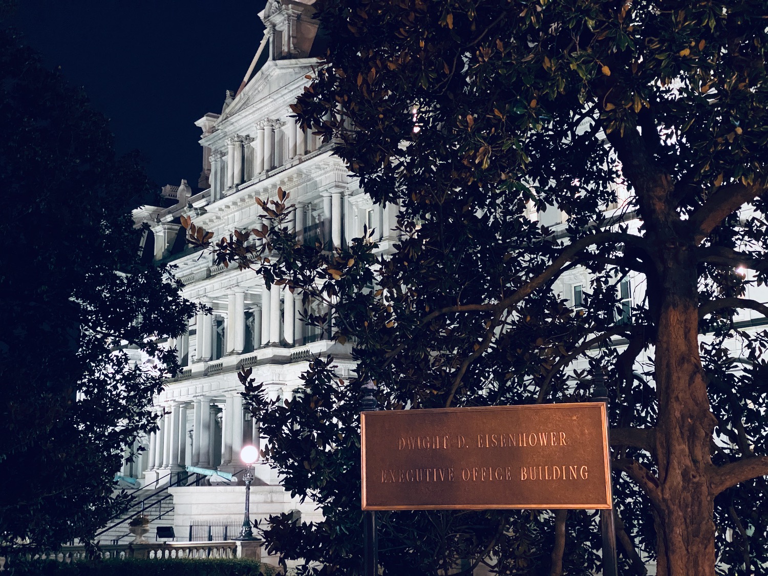 a sign in front of a building