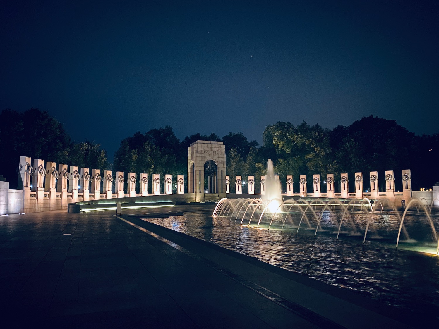 a water fountain in front of a monument