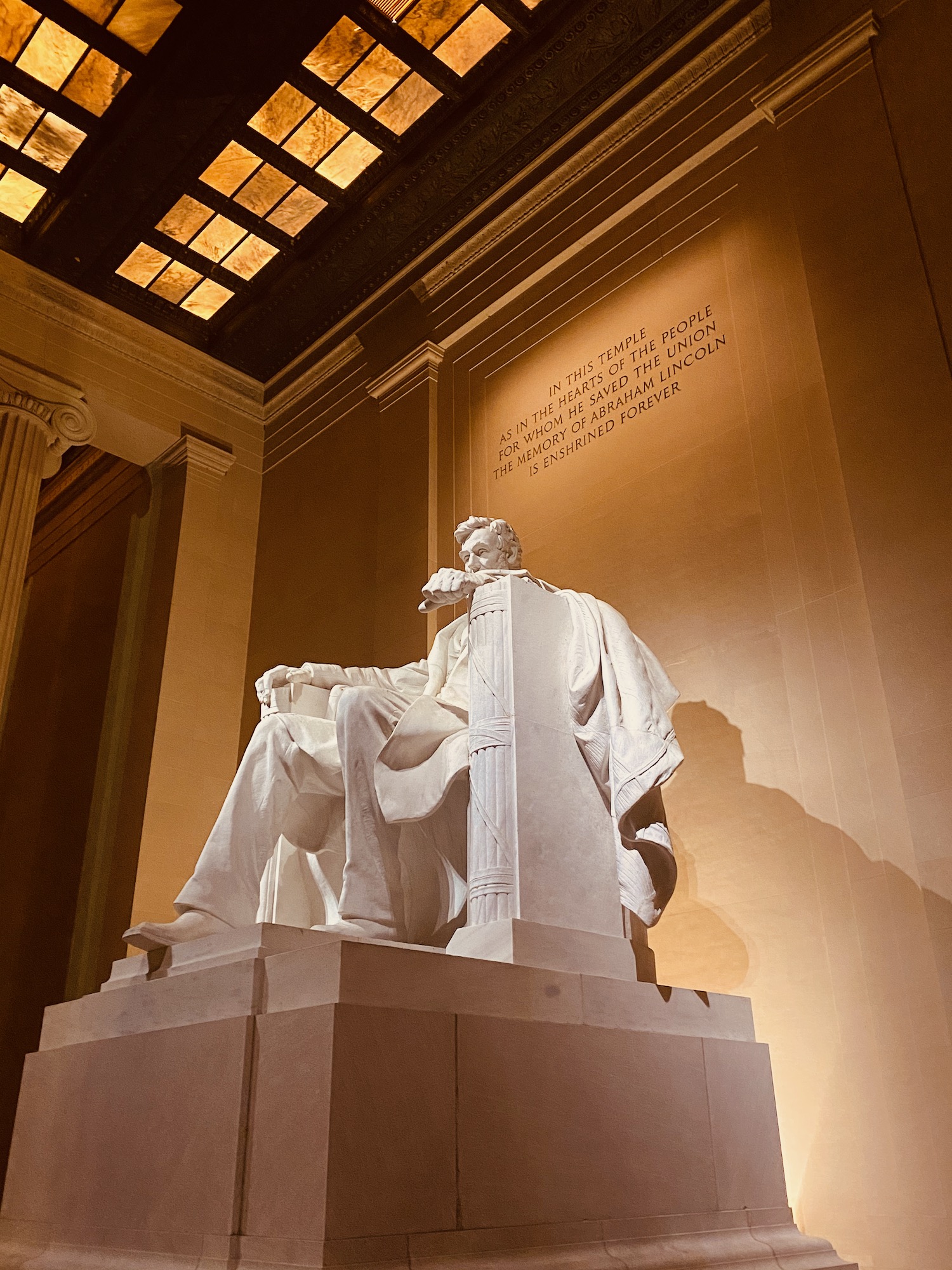 a statue of a man sitting on a pedestal