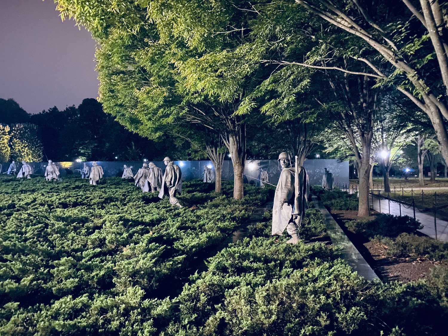 a group of statues in a park