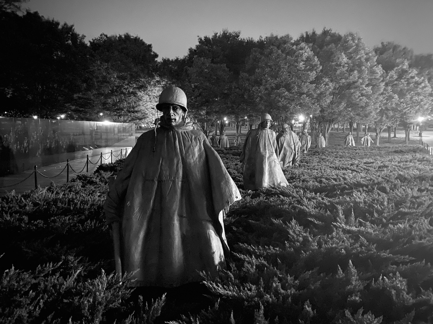 a group of men wearing capes and hats