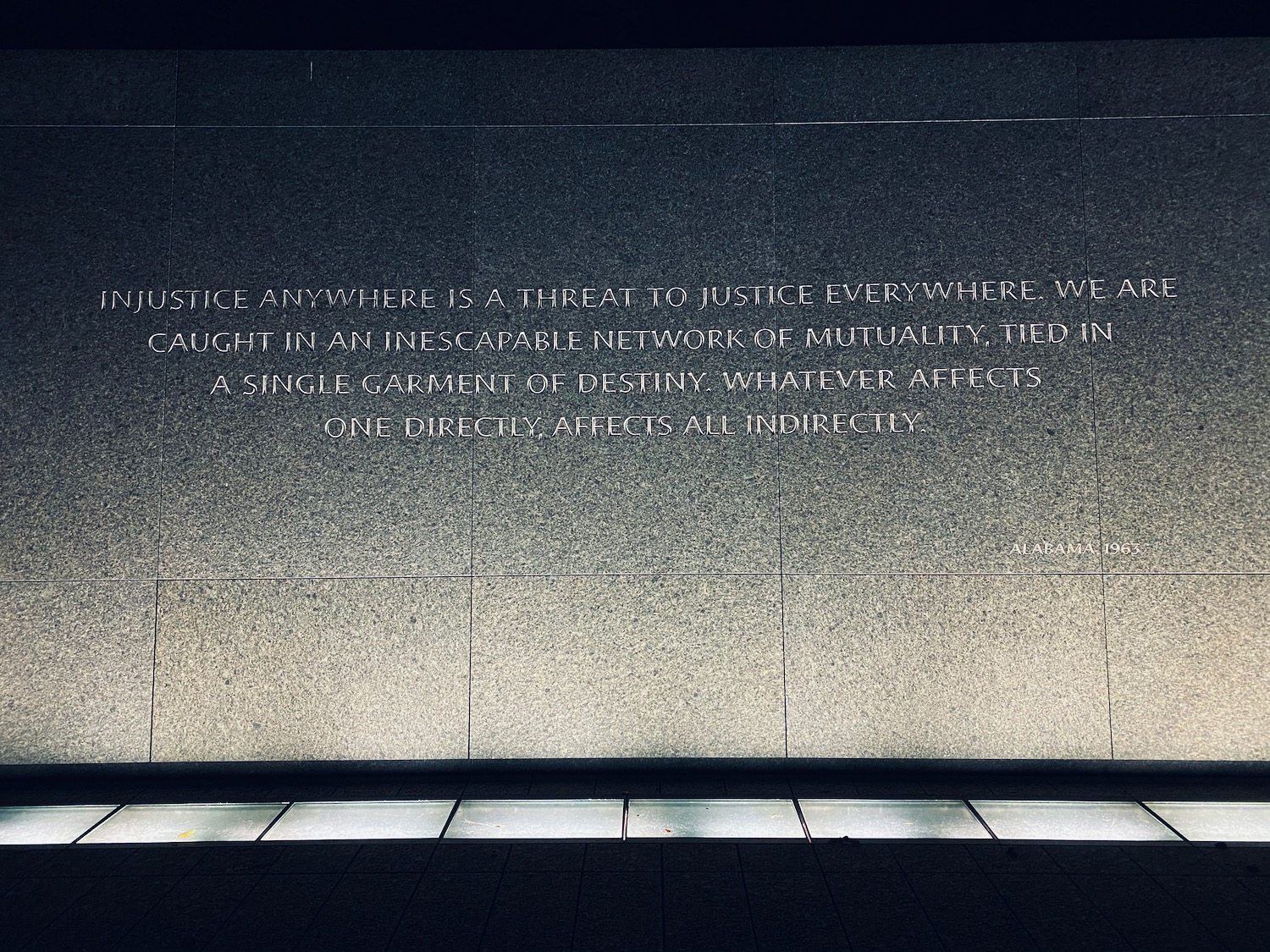 a stone wall with text on it