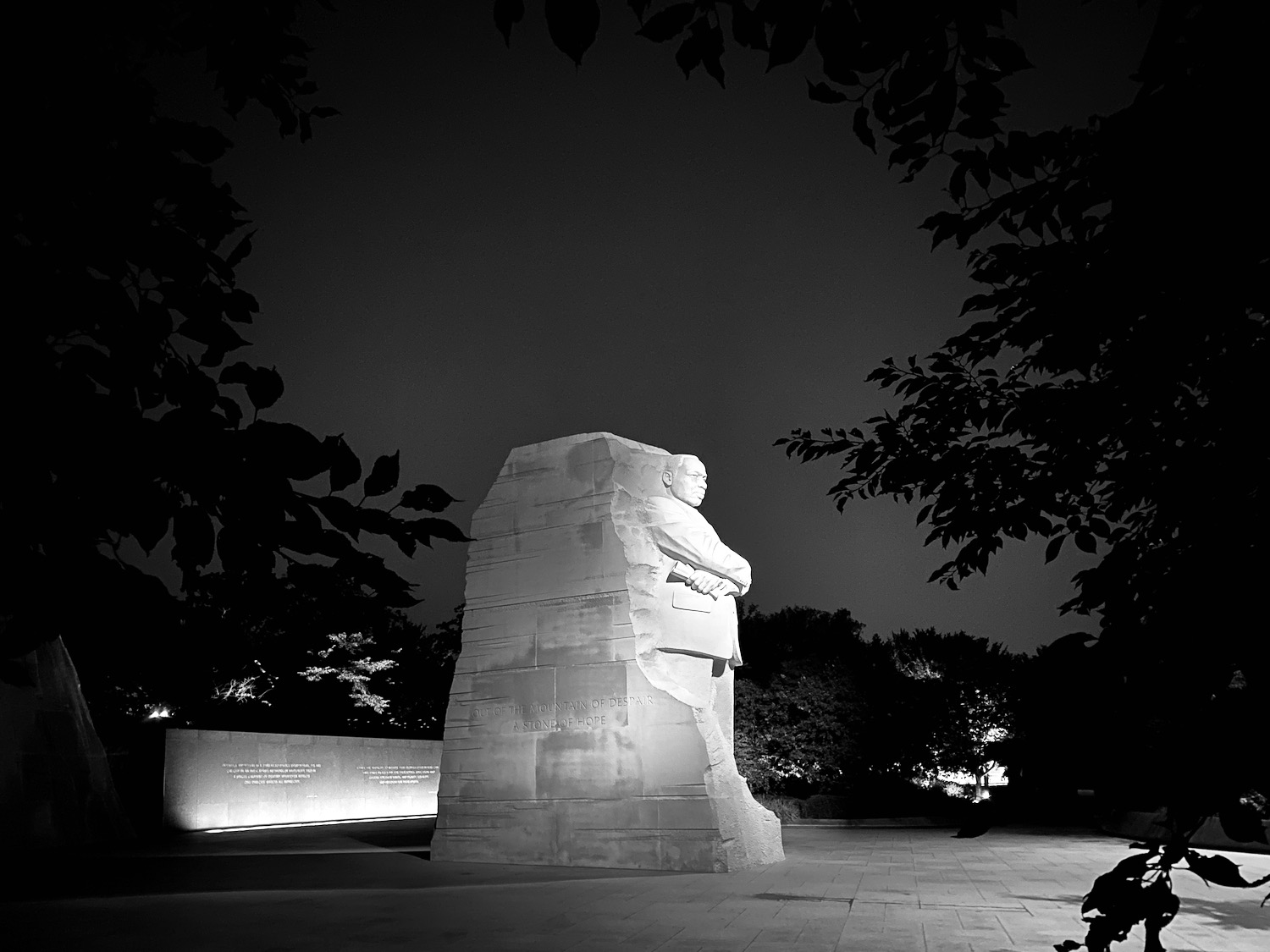 a statue of a man sitting on a chair