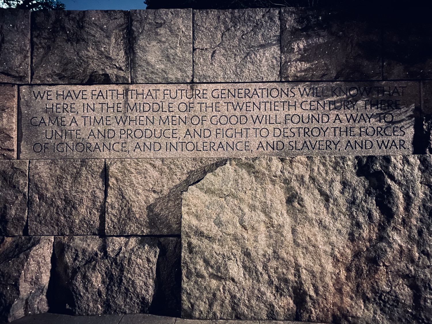 a stone wall with text on it