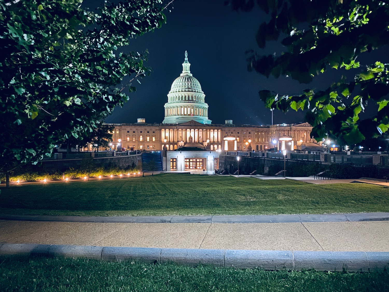 a large building with a dome at night