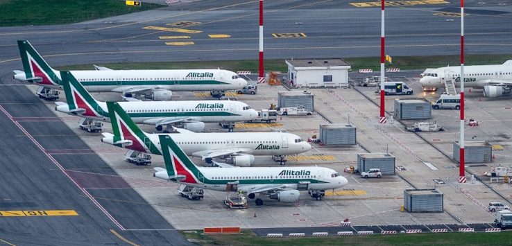 airplanes parked on a runway