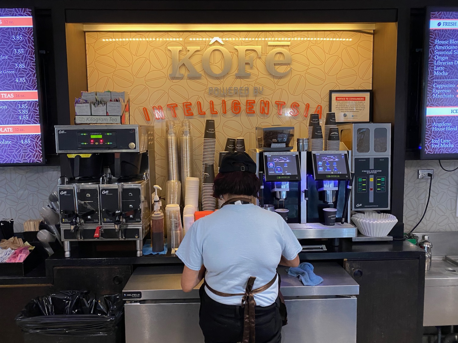 a woman working at a coffee shop