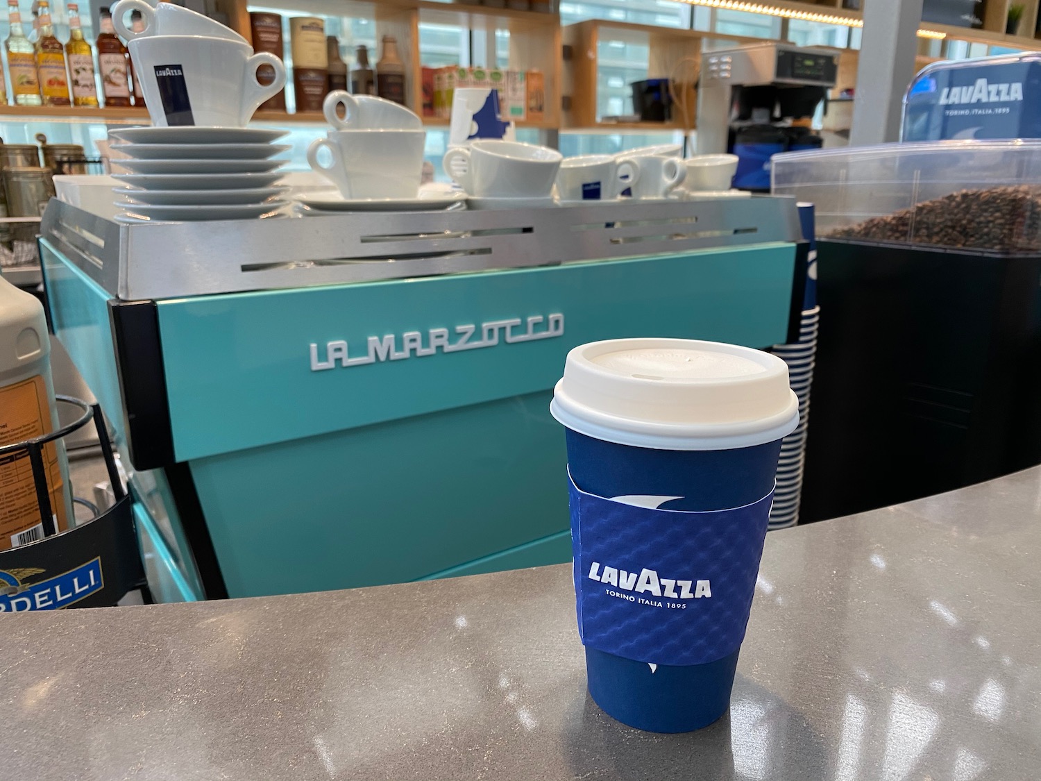 a blue coffee cup on a counter