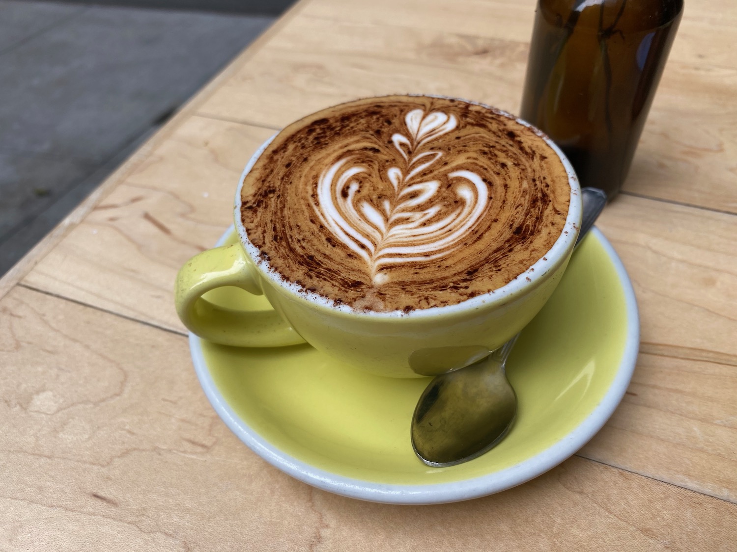 a cup of coffee with a heart design on top